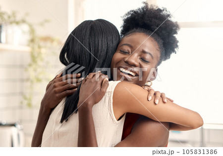 Finally reunited. Shot of two young friends spending time together at home. 105831386