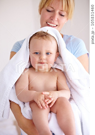 Baby, mom and hug for bath with care in a closeup for clean kid at home with love and caring. Towel, mother and infant with portrait to hold or hugs for care and love with kid in family home. Baby, mom and hug for bath with care in a closeup for clean kid at home with love and caring. Towel, mother and infant with portrait to hold or hugs for care and love with kid in family home. 105831460