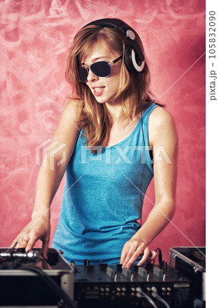 DJ woman, mixer and scratch with vinyl records, sunglasses and audio professional at club, studio or party. Girl, music and party with technology, turntable or techno for event, celebration or job 105832090