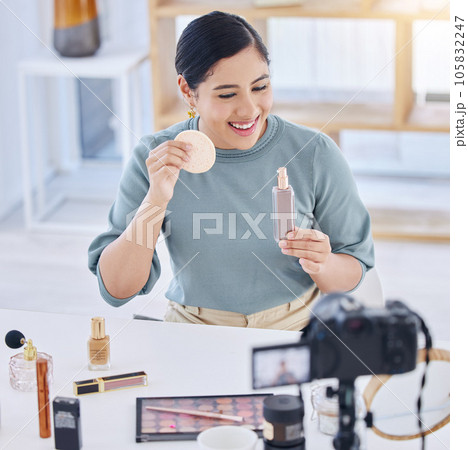 Makeup, influencer, camera and happy woman streaming tutorial for cosmetics, social media or skincare. Foundation, live stream and content creator with smile, product broadcast and beauty channel Makeup, influencer, camera and happy woman streaming tutorial for cosmetics, social media or skincare. Foundation, live stream and content creator with smile, product broadcast and beauty channel 105832247