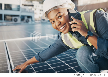 Portrait of happy black woman, solar panel and phone call for photovoltaic plate, sustainability advice or maintenance. Eco friendly energy, cellphone and female engineer smile for power saving check 105832484