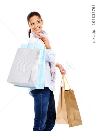 Woman, shopping bag and thinking in studio, white background and isolated retail product sales. Happy customer, rich model and gift bag for discount mall promotion, luxury store brand and market deal 105832768