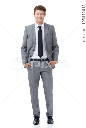 Hes a young up and comer in the corporate world. A handsome young businessman isolated on white. Hes a young up and comer in the corporate world. A handsome young businessman isolated on white. 105832812