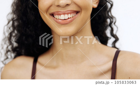 Woman, laughing or teeth on isolated white background in whitening promotion, orthodontic wellness or dental care routine. Zoom, smile or beauty model in lipstick, lip gloss or mouth makeup cosmetics 105833063