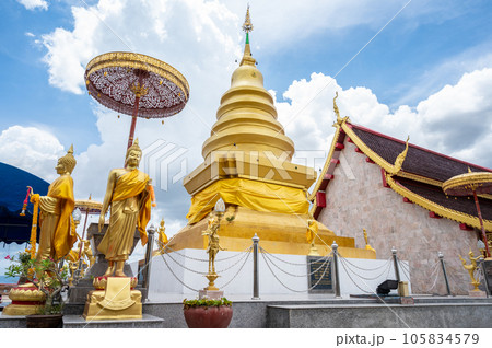 View of Wat Phra That Chom Chor an iconic ancient pagoda on the small hill in Thoeng district of Chiang Rai province Thailand. View of Wat Phra That Chom Chor an iconic ancient pagoda on the small hill in Thoeng district of Chiang Rai province Thailand. 105834579
