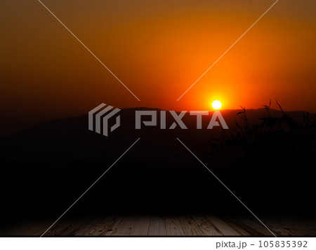 Empty Wooden Table counter on Sunset Nature with Forest and Mountain Background,Mock up with Display Sunrise landscape evening Sunlight Backdrop,Autumn Season Outdoor Design,Silhouette growth Tree. 105835392