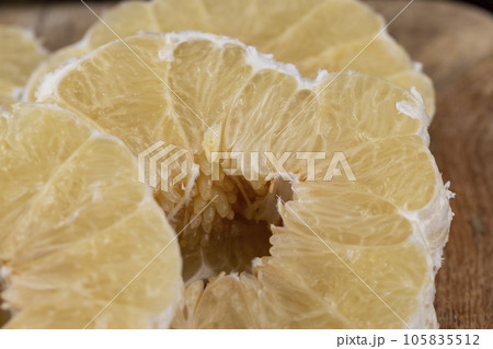 peeled pomelo on the table, close up peeled pomelo on the table, close up 105835512