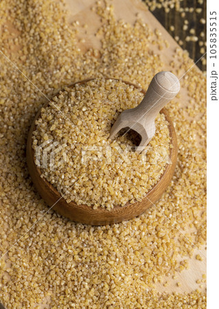 Fresh wheat porridge but cooked scattered on the table Fresh wheat porridge but cooked scattered on the table 105835515