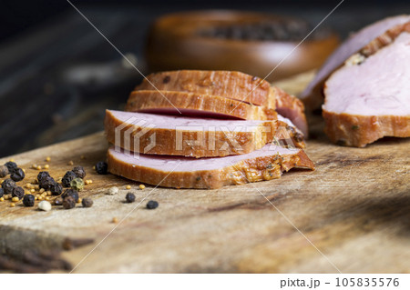 Cooked pork with spices on a board 105835576