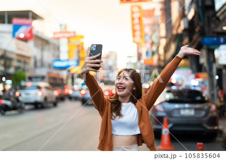 Young Asian tourists standing selfie taking a photo 105835604
