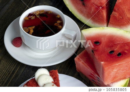 Red raspberry tea with pieces of fruit and berries 105835805
