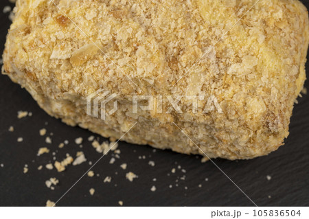 delicious piece of cake with puff pastry and sweet cream 105836504