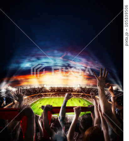 Football scene at night match with with cheering fans at the stadium Football scene at night match with with cheering fans at the stadium 105839506