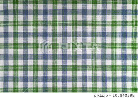 Green and blue checkered texture fabric, tartan pattern background. 105840399