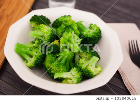 Diet food. steamed broccoli on plate 105840618