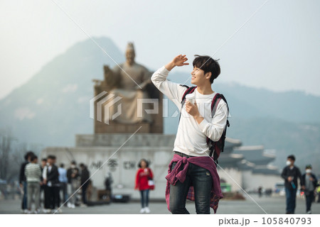 A young man traveling in Seoul, South Korea, with a backpack A young man traveling in Seoul, South Korea, with a backpack 105840793