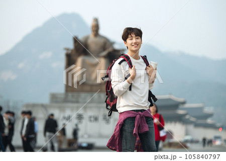 A young man traveling in Seoul, South Korea, with a backpack A young man traveling in Seoul, South Korea, with a backpack 105840797