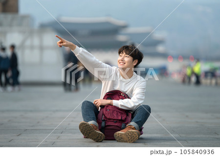 A young man traveling in Seoul, South Korea, with a backpack 105840936