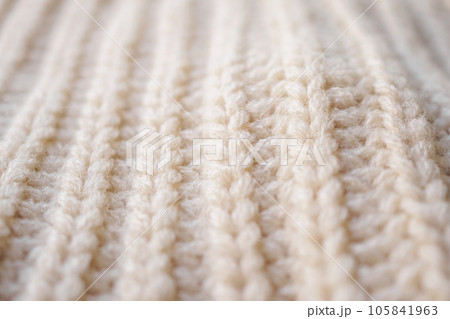 closeup beige knitted woolen fabric texture background 105841963