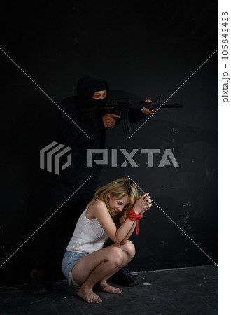 Terrorist with gun with women as hostages Terrorist with gun with women as hostages 105842423