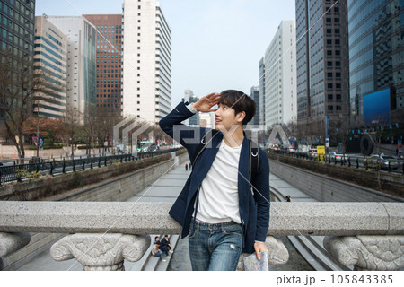 A young man traveling in Seoul, South Korea, with a backpack 105843385