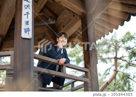A young man doing a backpacking trip in a Korean traditional house.	 105844303