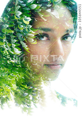 Double exposure portrait of a woman looking into the camera Double exposure portrait of a woman looking into the camera 105844551