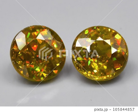Natural green sphene gemstone isolated on white background Natural green sphene gemstone isolated on white background 105844857