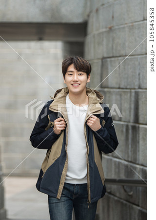 Young male college student traveling with a backpack in Korea 105845358