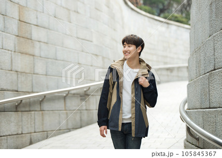 Young male college student traveling with a backpack in Korea 105845367