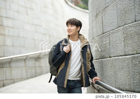 Young male college student traveling with a backpack in Korea 105845370