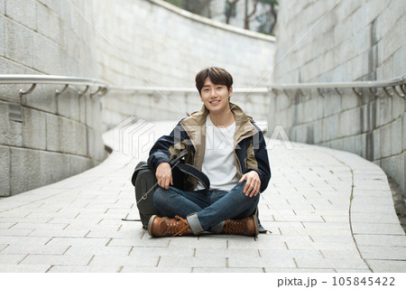 Young male college student traveling with a backpack in Korea 105845422