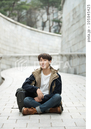 Young male college student traveling with a backpack in Korea 105845425