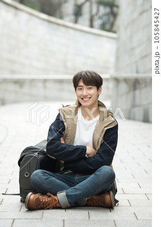 Young male college student traveling with a backpack in Korea 105845427