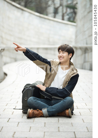 Young male college student traveling with a backpack in Korea 105845430