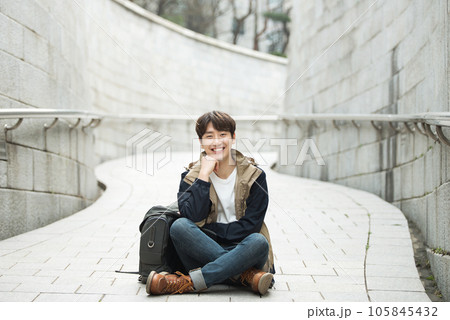 Young male college student traveling with a backpack in Korea 105845432