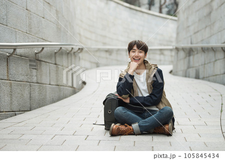 Young male college student traveling with a backpack in Korea 105845434