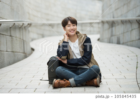 Young male college student traveling with a backpack in Korea 105845435