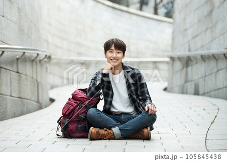 Young male college student traveling with a backpack in Korea 105845438