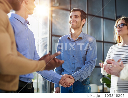 Two happy diverse professional business men executive leaders shaking hands at office meeting. Two happy diverse professional business men executive leaders shaking hands at office meeting. 105846205