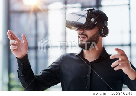 Businessman in virtual reality glasses or headset 105846249