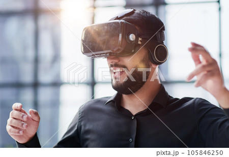 Businessman in virtual reality glasses or headset 105846250