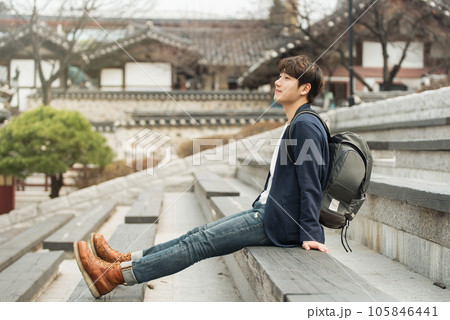young man sitting on the stairs 105846441