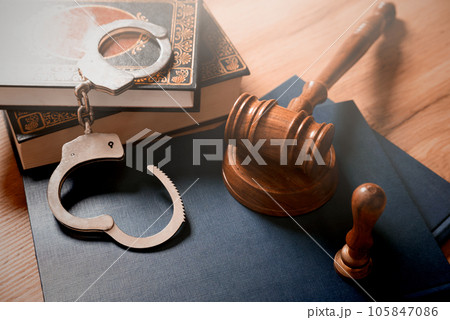 Handcuffs and wooden gavel. Crime concept. Handcuffs and wooden gavel. Crime concept. 105847086