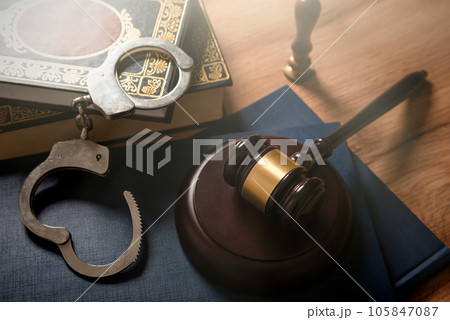 Handcuffs and wooden gavel. Crime concept. Handcuffs and wooden gavel. Crime concept. 105847087