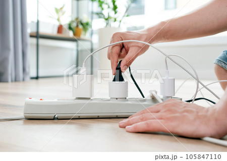 Electrical plug in outlet socket at home Electrical plug in outlet socket at home 105847110