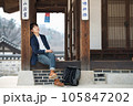 a young man resting in a traditional Korean house 105847202
