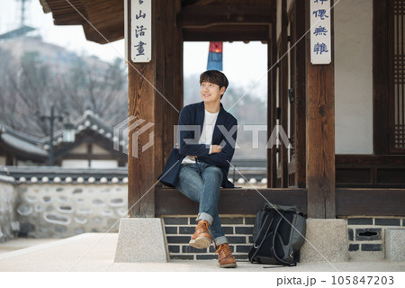 a young man resting in a traditional Korean house a young man resting in a traditional Korean house 105847203