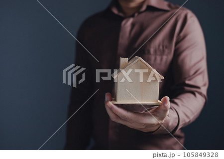 the businessman holding a piggy bank, donation, charity, fundraising, superannuation, investment, saving, family finance plan concept, Money Saving Ideas for Buying a Home. the businessman holding a piggy bank, donation, charity, fundraising, superannuation, investment, saving, family finance plan concept, Money Saving Ideas for Buying a Home. 105849328