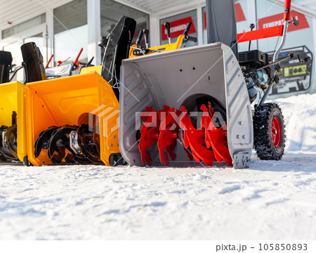 Kemerovo, Russia, February 17, 2022. A new petrol snowplow is on sale. Snow removal mechanism. A device for snow removal at home in winter. 105850893